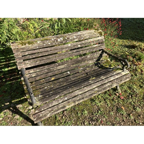 222 - A good antique cast iron and timber roll back garden seat. (This possible had a sun canopy at one st... 