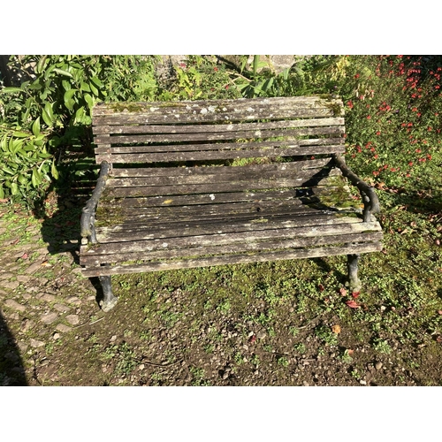 222 - A good antique cast iron and timber roll back garden seat. (This possible had a sun canopy at one st... 