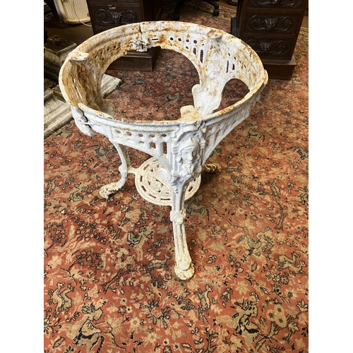 225 - Antique cast iron garden table with stone top, the table has a few old repairs and the stone top is ... 