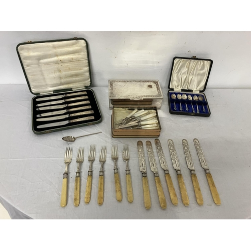 244 - Silver plated cigarette box; a set of 6 fruit knives cased, Sheffield 1933; a set of 6 coffee spoons... 