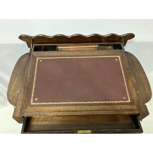 257 - Good Victorian rosewood writing desk cum workbox having a rising slope with leather inset over drawe... 