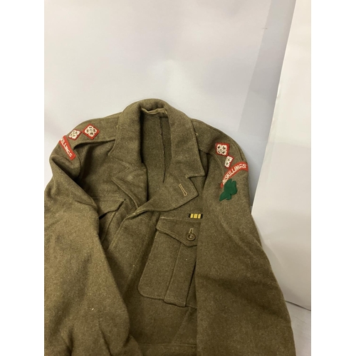 266 - A World War II Military Uniform - jacket, trousers, belt (insignia removed) and two other jackets.