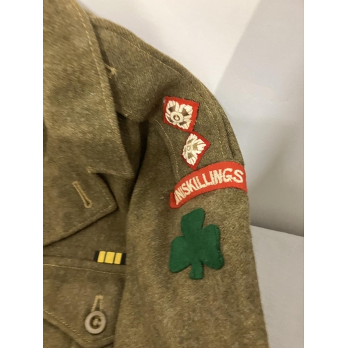 266 - A World War II Military Uniform - jacket, trousers, belt (insignia removed) and two other jackets.