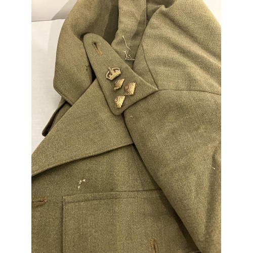 266 - A World War II Military Uniform - jacket, trousers, belt (insignia removed) and two other jackets.