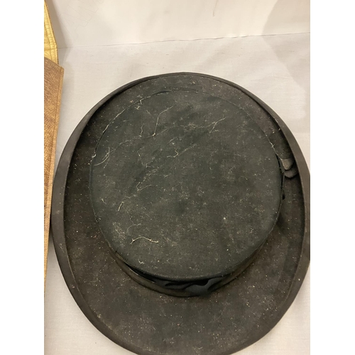 276 - Hat box containing hard top hat from the Munster Arcade Cork together with a folding top hat from Th... 