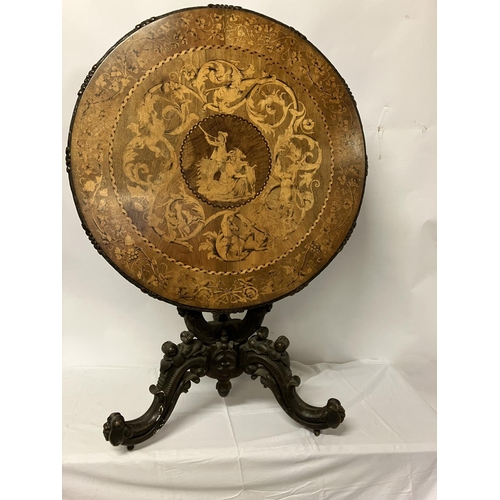 300 - A good 19th century circular table, the extensive inlaid top having carved border and raised on simi... 