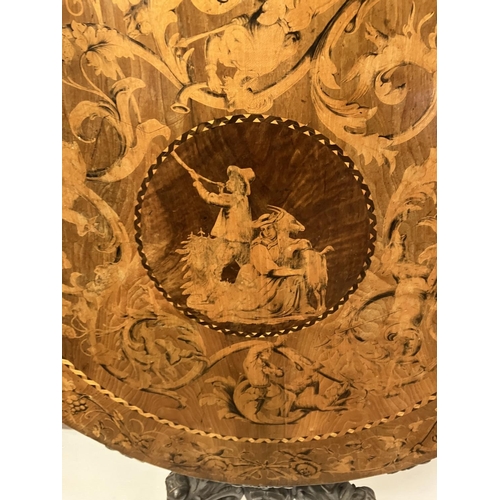 300 - A good 19th century circular table, the extensive inlaid top having carved border and raised on simi... 