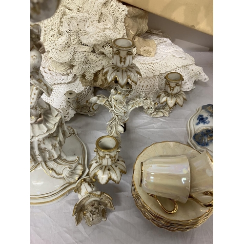 303 - A large mixed lot to include porcelain & china ware as found, two canvas paintings unframed and quan... 