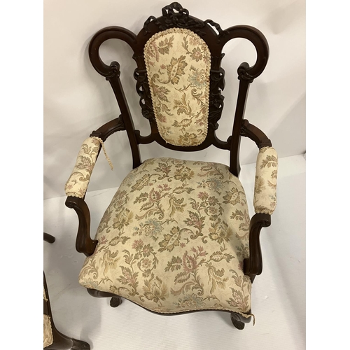 327 - A pair of attractive Edwardian open arm chairs. (repair on arm)