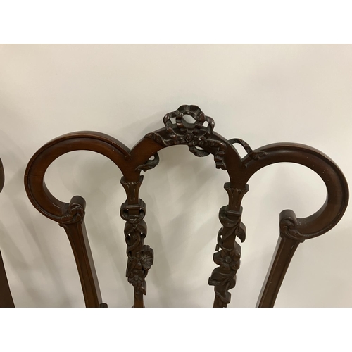 328 - A pair of Edwardian mahogany side chairs with a pair of low chairs.