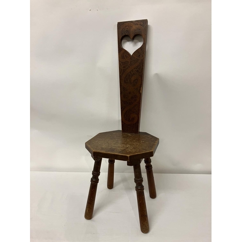 35 - Old poker work chair with Celtic Motifs and raised on turned legs.