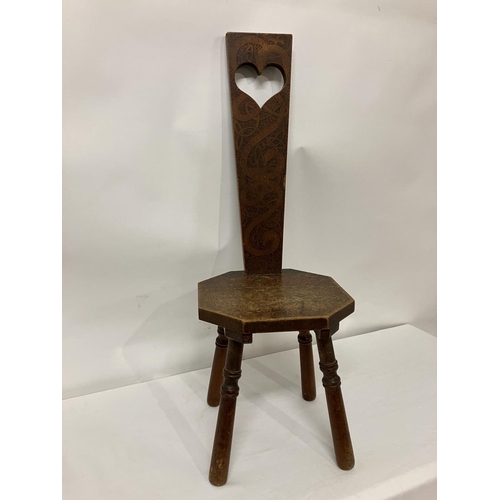 35 - Old poker work chair with Celtic Motifs and raised on turned legs.