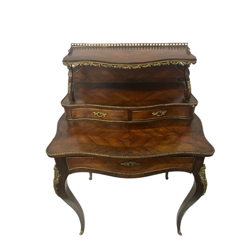 374 - A 19th century Kingswood ladies writing desk, crossbanded in rosewood, the upper section having bras... 