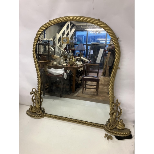 384 - A large Victorian gilt framed over mantle mirror, rope shaped & dolphin decoration and good panel ba... 