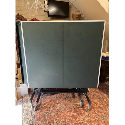 407 - A table tennis table. 274cm x 153cm approx.