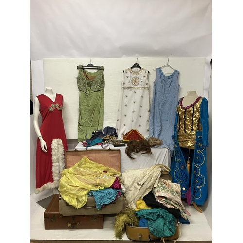 410 - A collection of theatre costumes (drag), shoes, wigs, jewellery, etc.