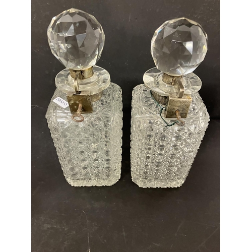 61 - A lot of glassware to include a pair of square shaped cut glass decanters with silver mounts and loc... 