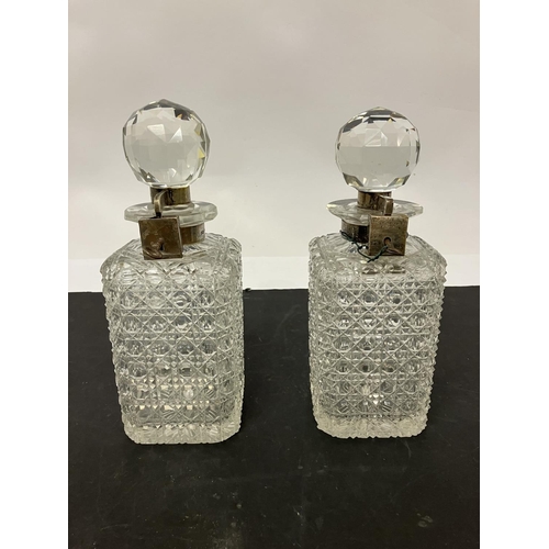 61 - A lot of glassware to include a pair of square shaped cut glass decanters with silver mounts and loc... 