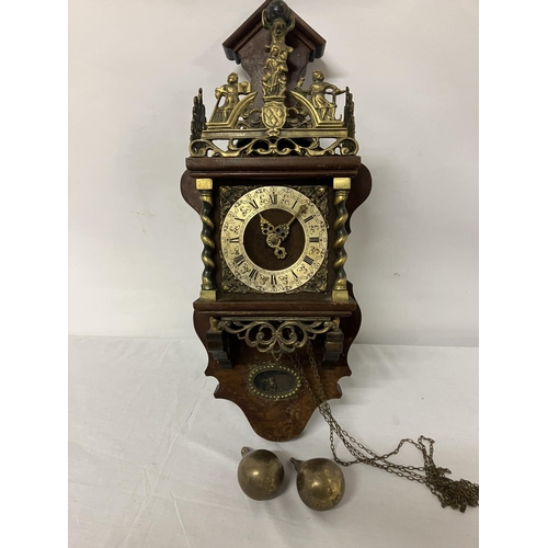 63 - Mahogany and brass mounted wall clock with pear shaped weights.