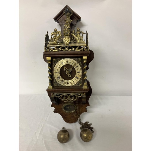 63 - Mahogany and brass mounted wall clock with pear shaped weights.