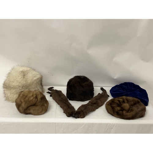 69 - A lot of fur hats and mink stole.