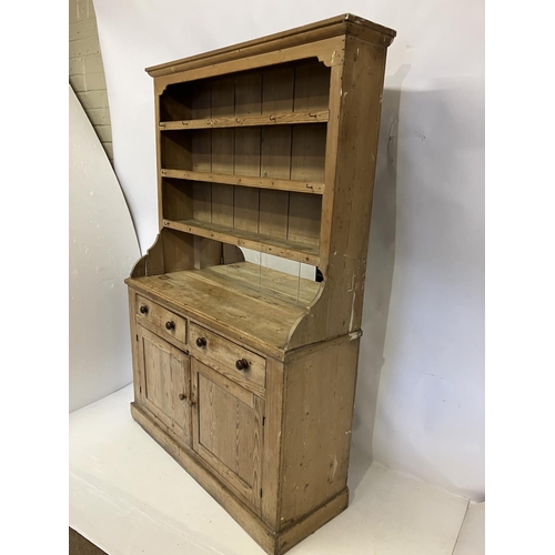 70 - Old Irish pine kitchen dresser having 3 shelves and the base fitted with drawers and cupboards. H. 2... 