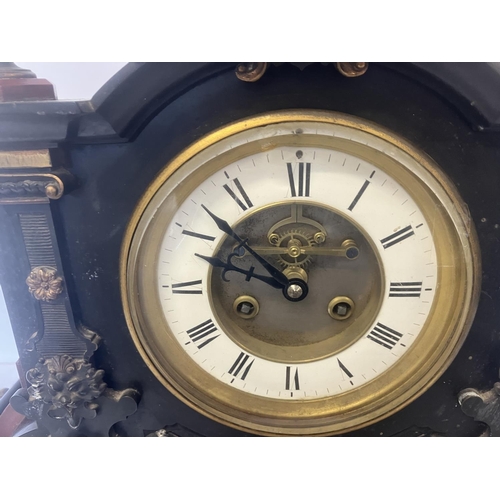 80 - A good large French 19th century mantel clock, the decorative rouge and black marble case fitted wit... 