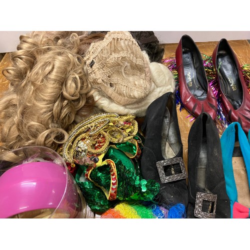 410 - A collection of theatre costumes (drag), shoes, wigs, jewellery, etc.