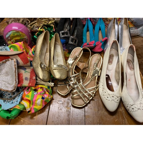 410 - A collection of theatre costumes (drag), shoes, wigs, jewellery, etc.