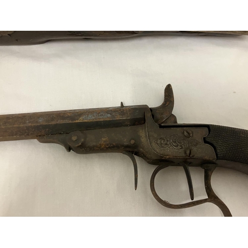 249 - Two antique pistols - one with name and ramrod. AF.