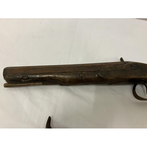 249 - Two antique pistols - one with name and ramrod. AF.