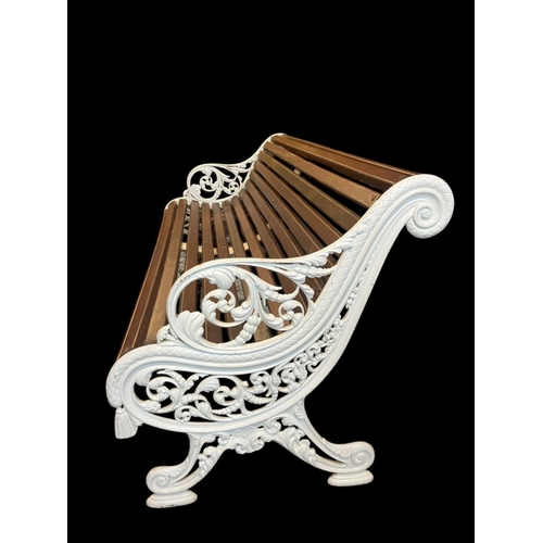 250 - A good large antique cast iron and timber garden seat having decorative ends, centre support and re-... 