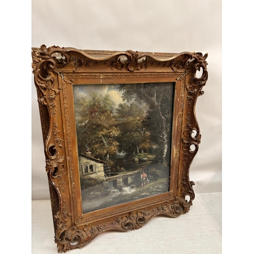 260 - A large painting in decorative frame, Children fishing in a stream by a house. Overall size - 145cm ... 