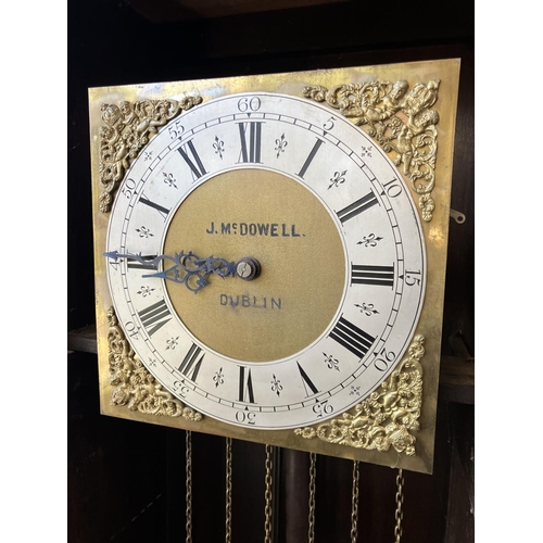 319 - J. McDowell, Dublin - Chiming long cased clock in oak case. H. 200cm.