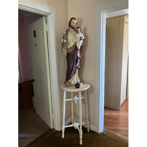 349 - A statue of Joseph and a child on stand.