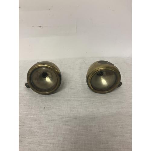 103 - A pair of brass car lamps by Howes & Burley.