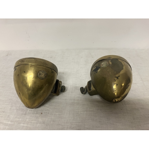 103 - A pair of brass car lamps by Howes & Burley.