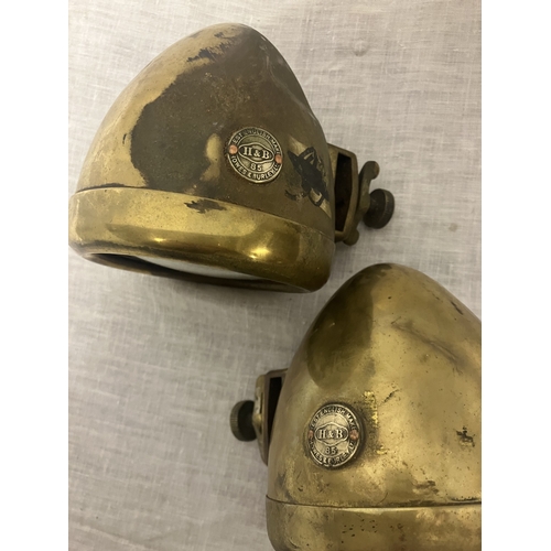 103 - A pair of brass car lamps by Howes & Burley.