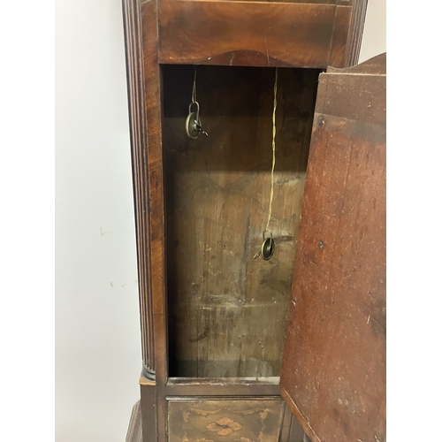 120 - An 18th century Irish long cased clock by Phil Glasco, Dublin having arched brass dial and inlaid ma... 