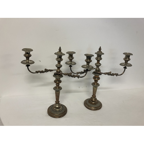 195 - A pair of Sheffield plated candleabra.