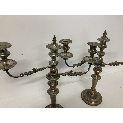 195 - A pair of Sheffield plated candleabra.