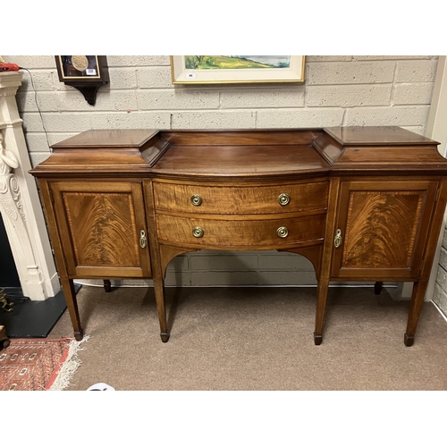 347 - Antique mahogany sideboard having nicely figured doors bow shaped drawers and raised on tapering leg... 