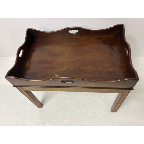 105 - Mahogany butlers tray on lift off base. W. 74cm, D. 46cm, H. 48cm.