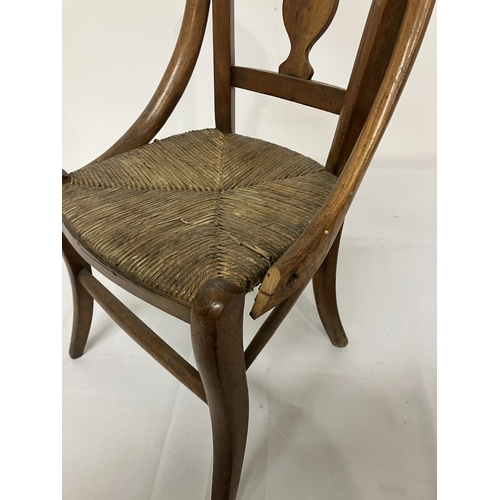 17 - A 19th century child's chair, possibly cedar wood. (one arm damaged)
