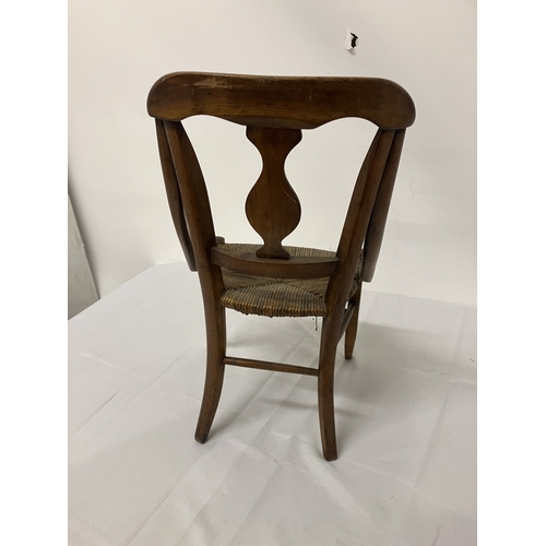 17 - A 19th century child's chair, possibly cedar wood. (one arm damaged)