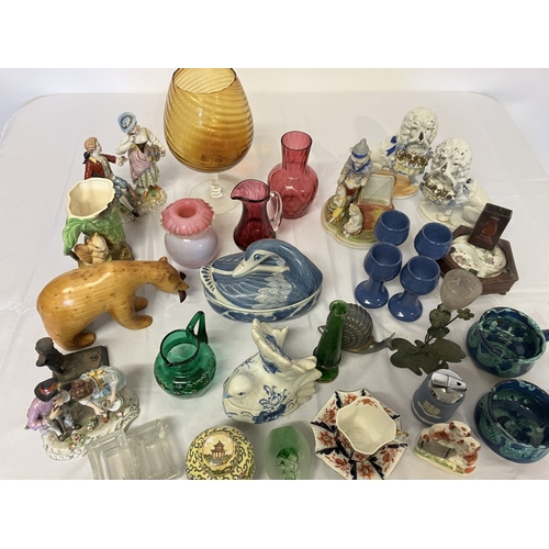 27 - Mixed lot of china and glassware to include red and green glass ware, china figures, etc.
