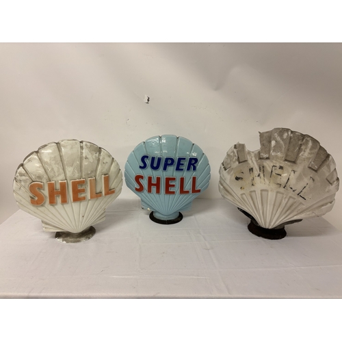 A collection of 3 Shell petrol pump tops. The small white one is in ...
