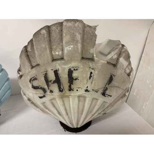 A collection of 3 Shell petrol pump tops. The small white one is in ...