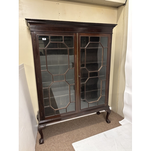 29 - Mahogany two door drawing room cabinet with section glass doors and raised on ball and claw feet. H.... 
