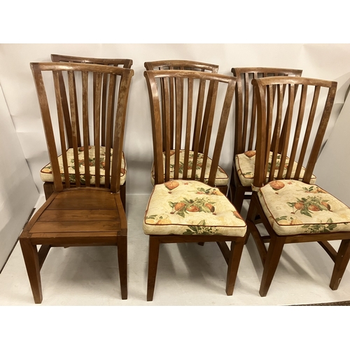 48 - Six large pine kitchen chairs.  
* Correction - teak not pine**